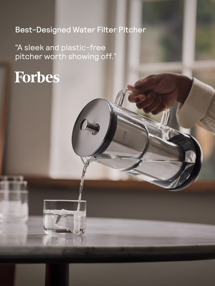 Pouring filtered water from the Aarke Purifier – awarded Best-Designed Pitcher by Forbes.