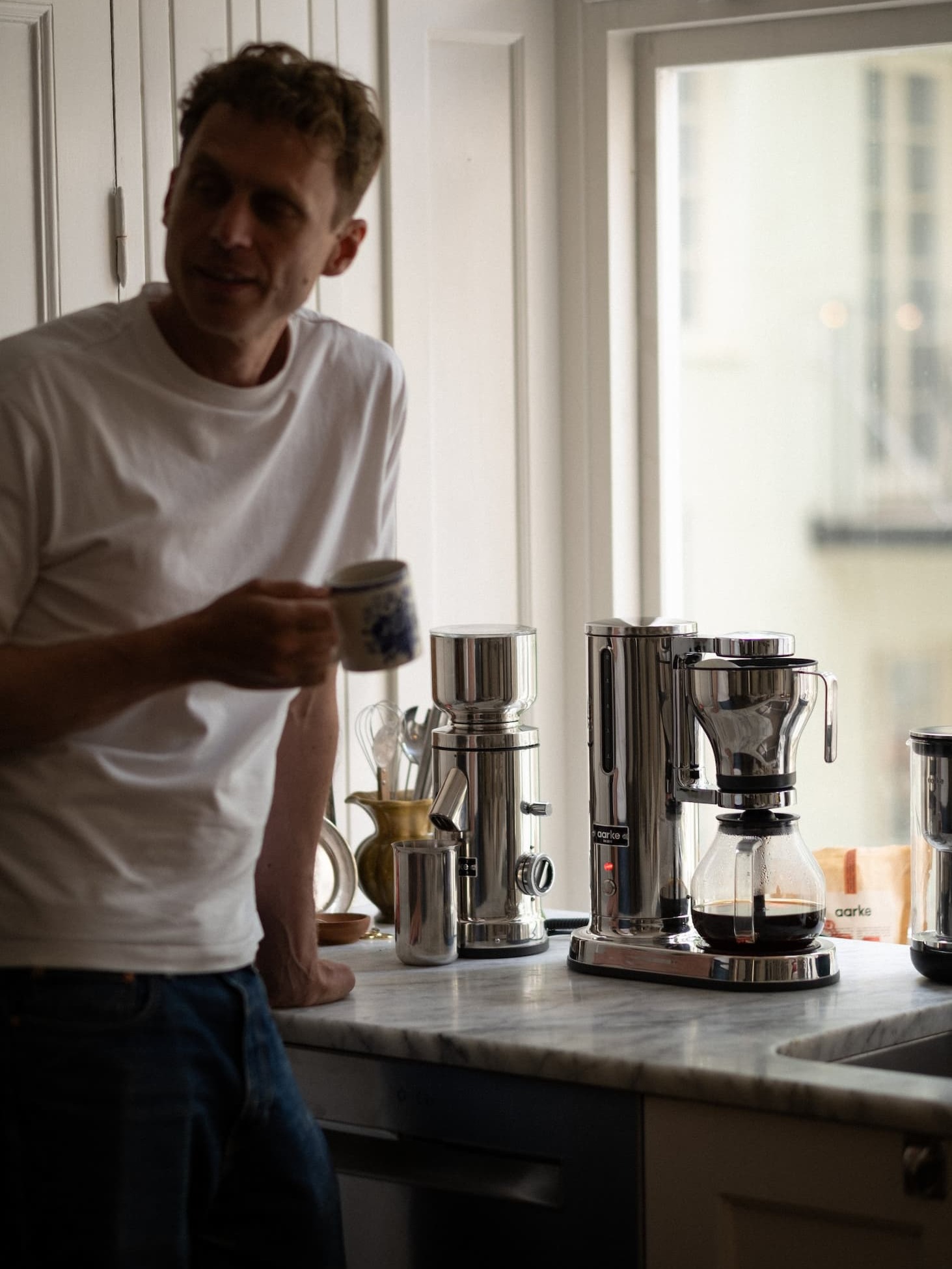 Aarke Coffee System at home with man drinking coffee