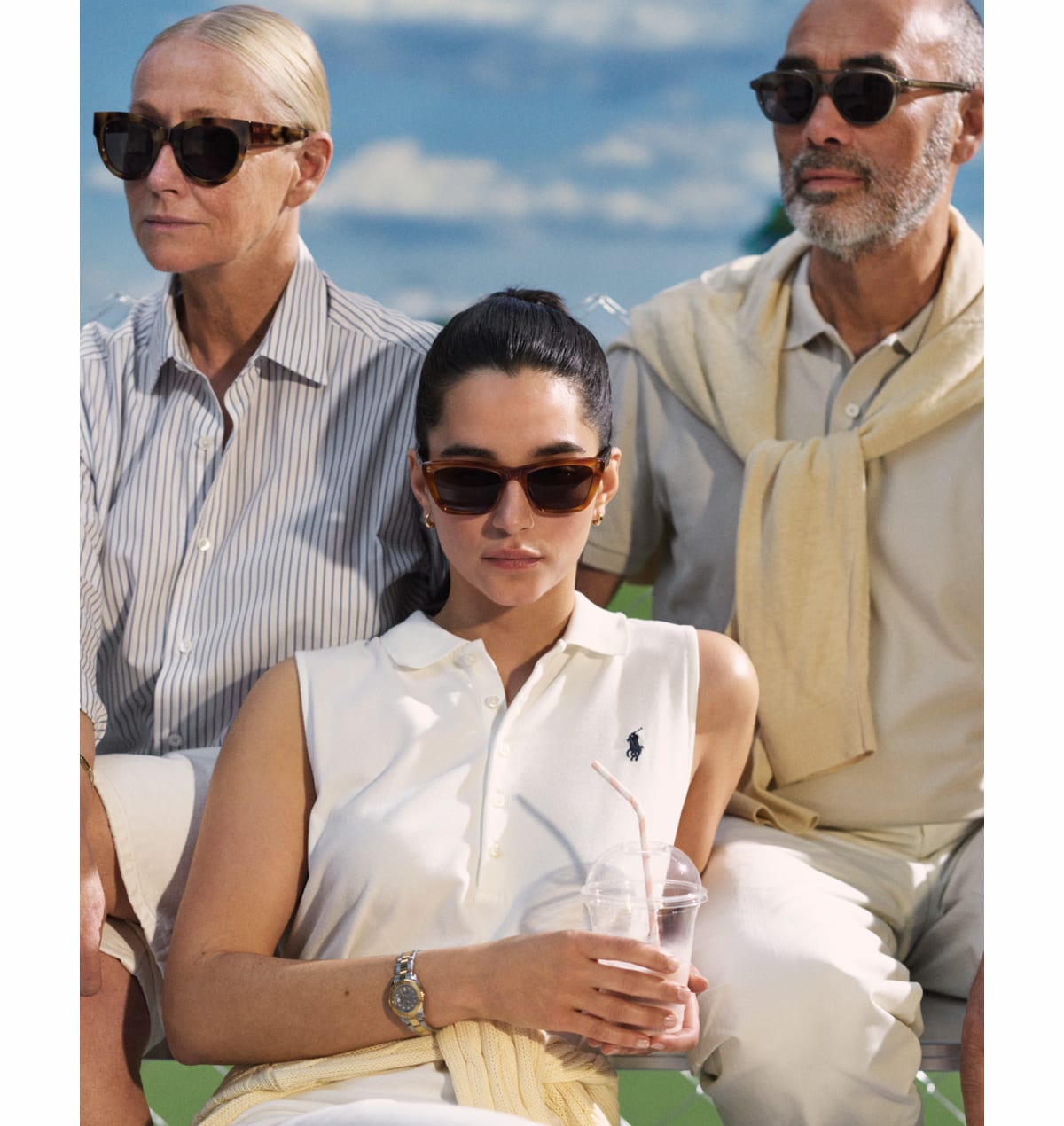 Three models wearing sunglasses