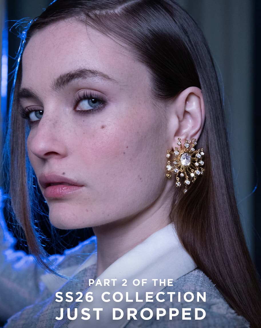 Model wearing Crystal Chandelier Earring and Lucite Top Handle Clutch