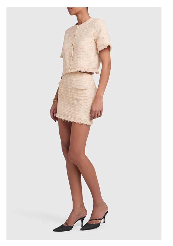 girl in a beige tweed set