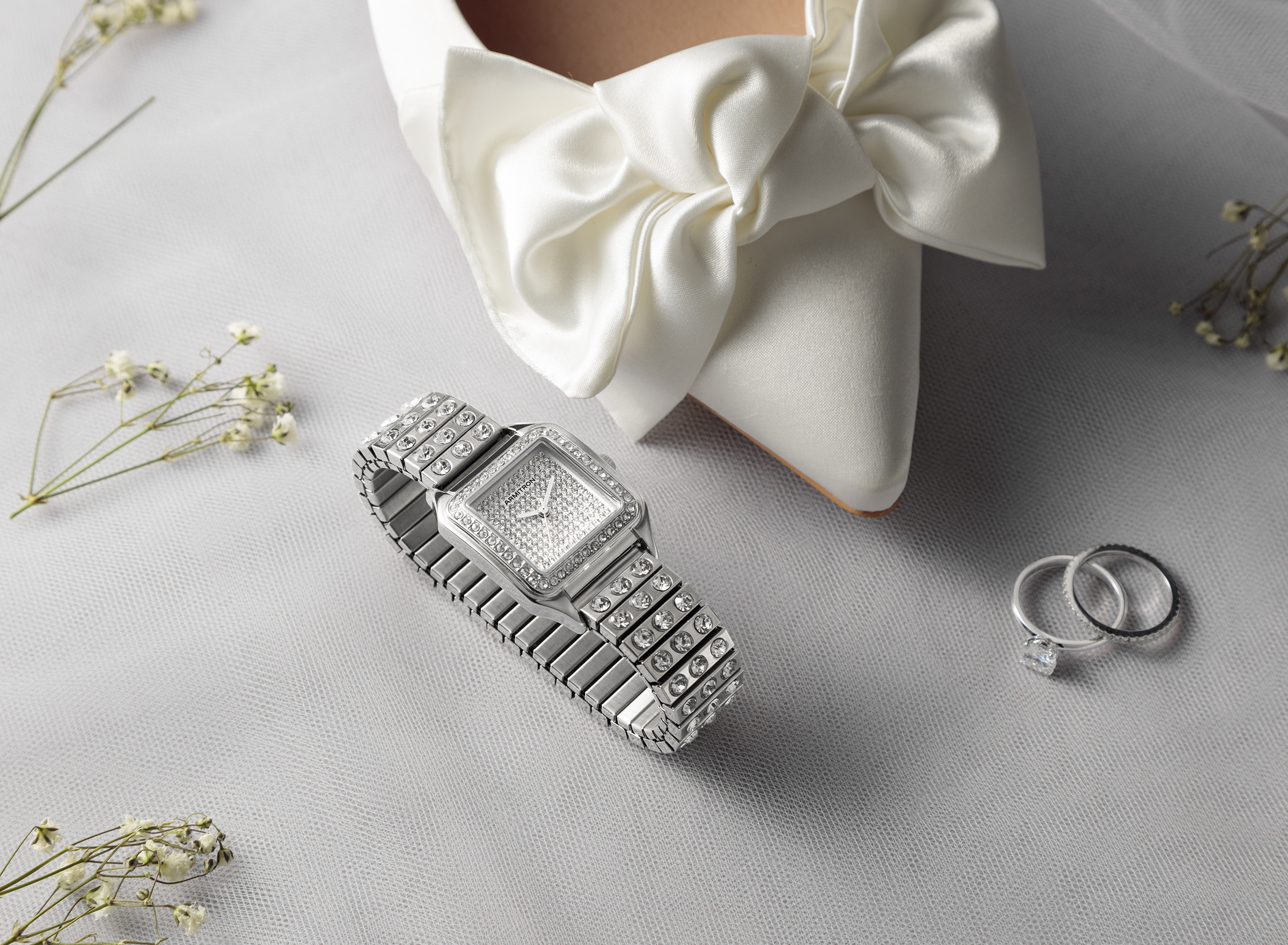 image of Roxy Watch with wedding rings and wedding shoe 