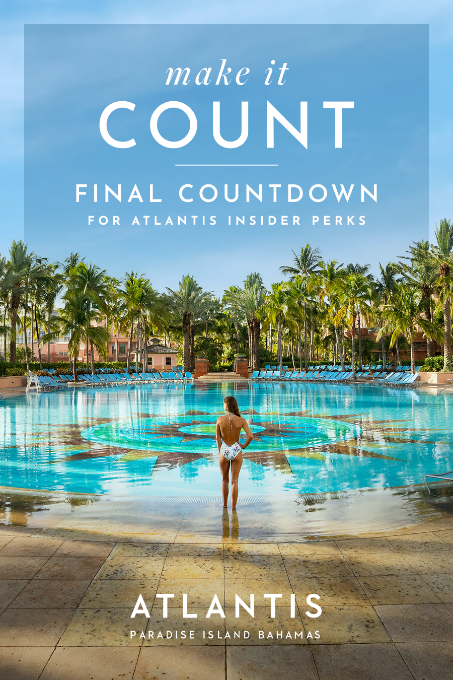 Make It Count: Final Countdown for Atlantis Insider Perks at Atlantis Bahamas. | A woman in a swimsuit looks out over a massive resort pool with a mosaic design.