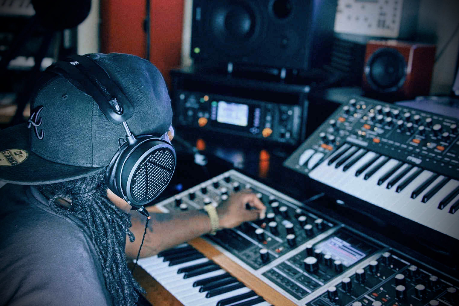 Snipe young working on a mixing board in studio