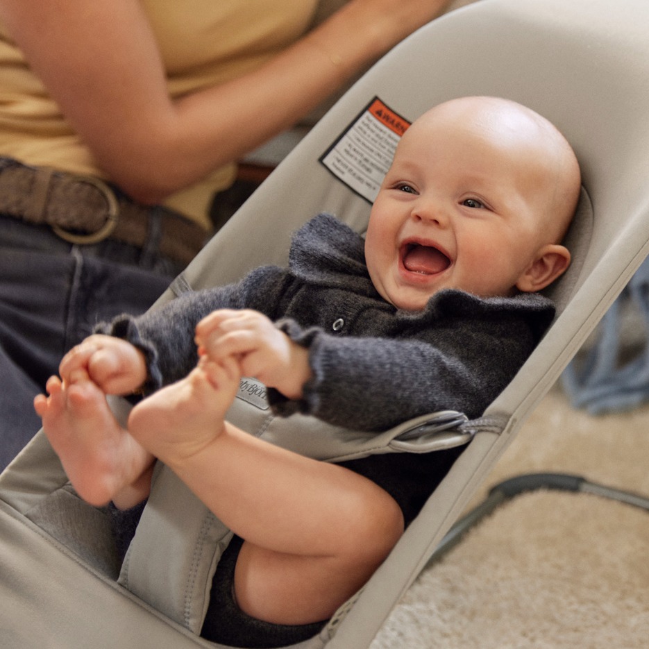 Baby smiling in bouncer