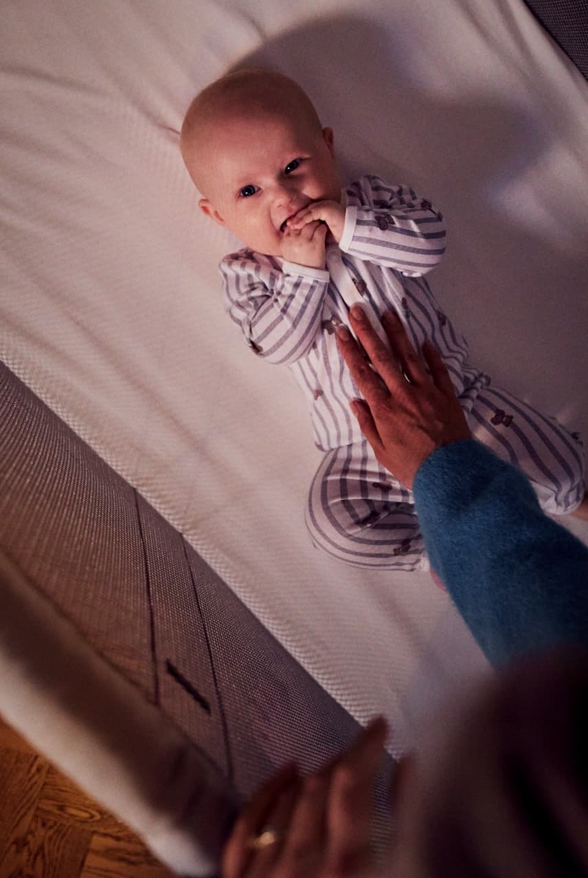 baby in travel crib 