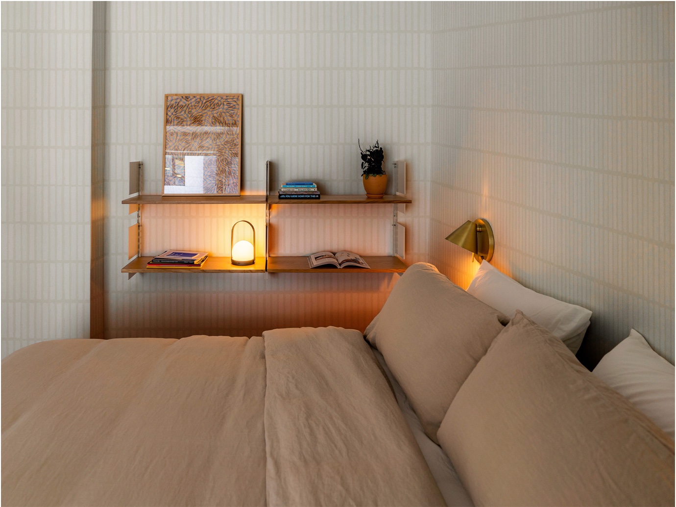 Backdrop's geometric wallpaper design, WABI-SABI in Light Beige, shown in a neutral bedroom.