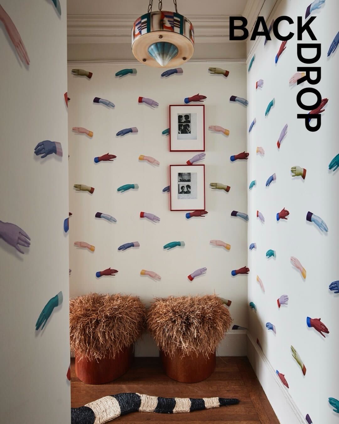 MANOS wallpaper by Charlap Hyman & Herrero—Multi on Ivory colorway shown installed in a hallway