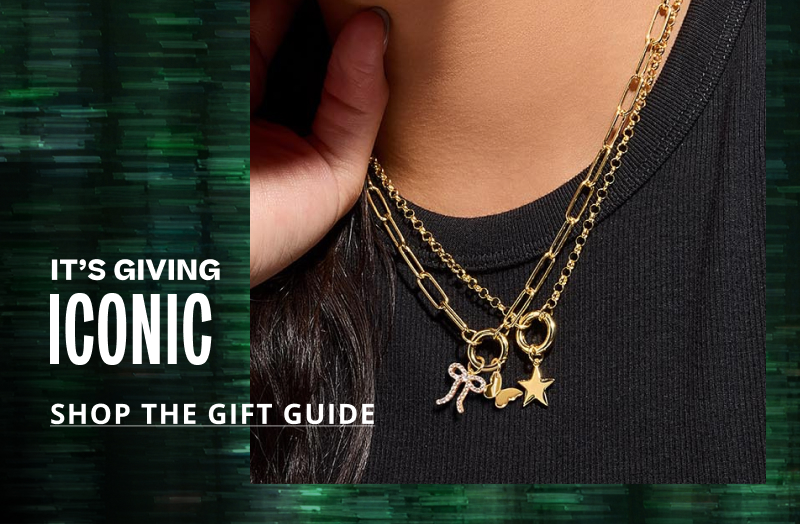 Male model wearing variety of bold silver, gold & diamond jewelry. It's giving best reaction ever. Click here to shop the gift guide