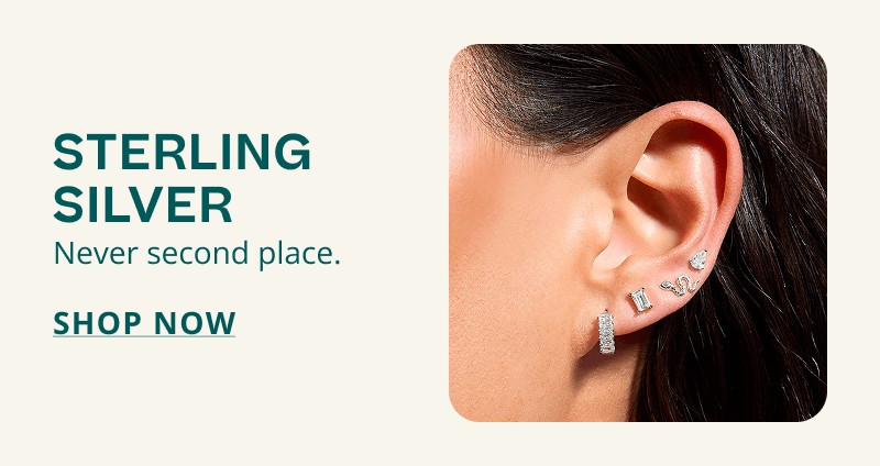 Model’s ear wearing unique silver studs. Sterling silver. Never second place. Click here to shop now.
