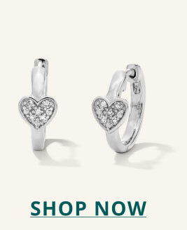 Silver huggies with diamond, heart-shaped detail. Click here to shop now