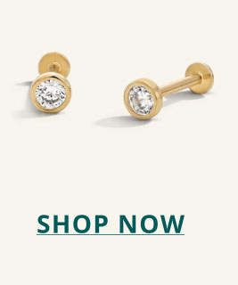 Gold, circle-cut diamond studs. Click here to shop now