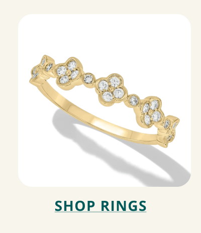 Gold ring, with clustered diamond details. Click here to shop rings.