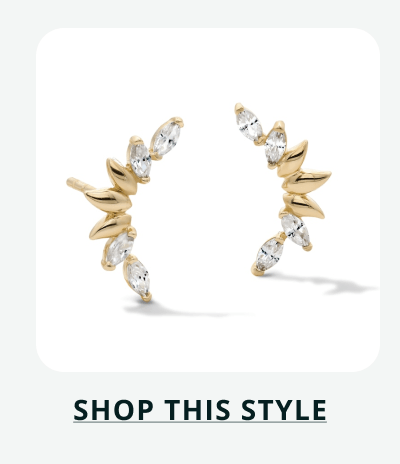 Pair of gold marquise-cut diamond ear climbers. Click here to shop this style