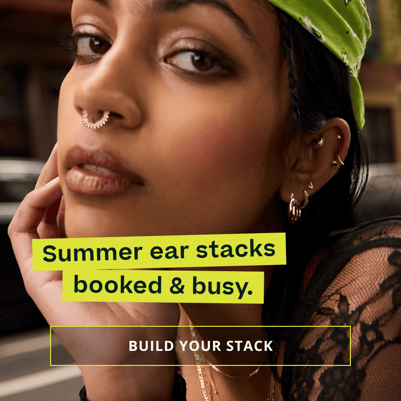 Model with gold huggies, studs & septum hoop. Ear stacks, booked & busy. Click here to build your stack