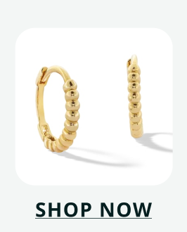 Pair of small gold huggies with beaded texture. Click here to shop now