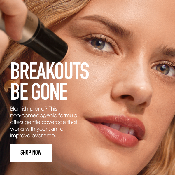 Model holding Complexion rescue skin tint stick