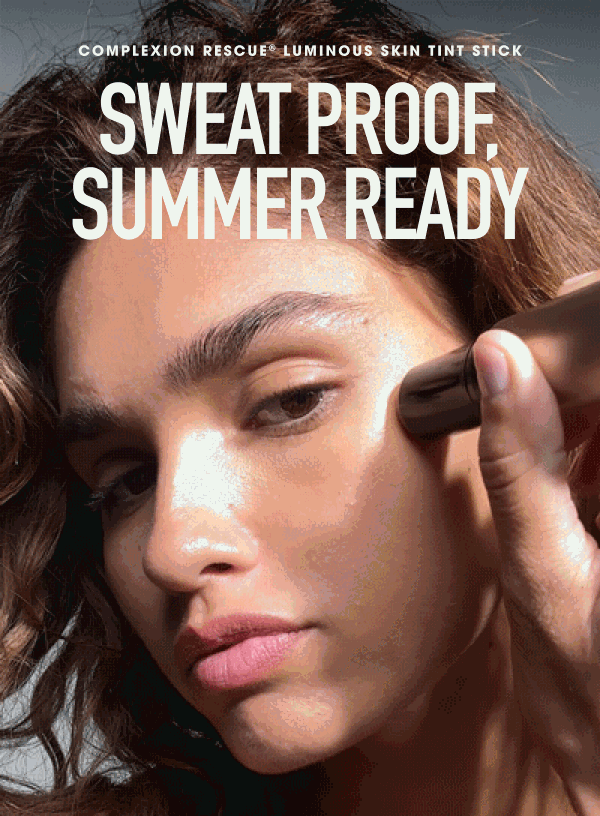 Model applying COMPLEXION RESCUE® LUMINOUS SKIN TINT STICK