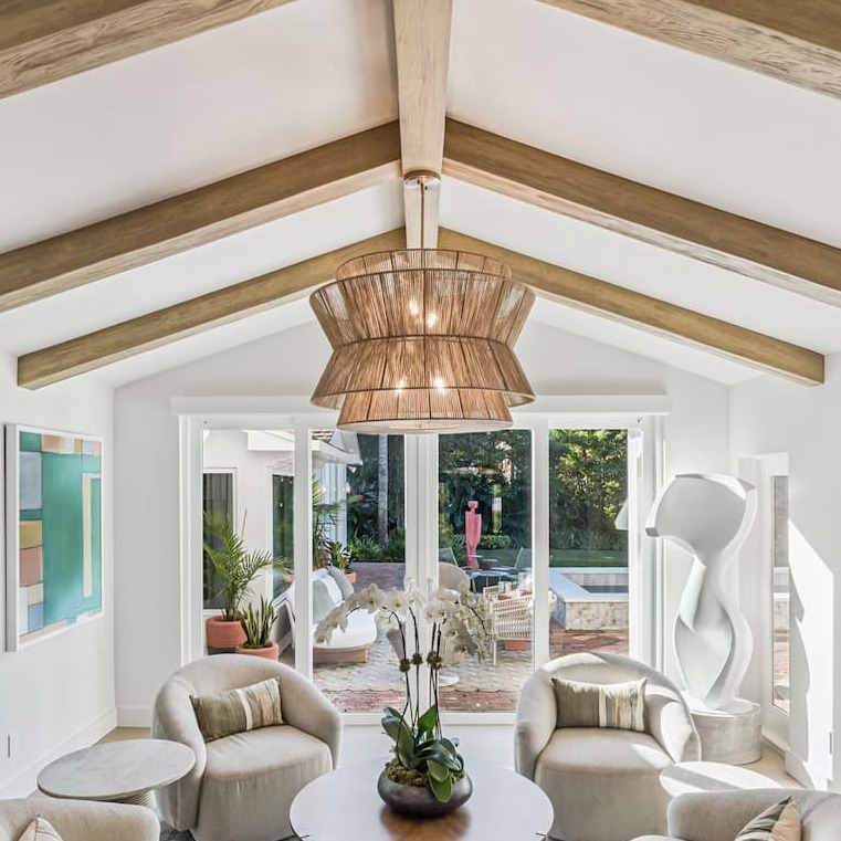 Faux wood beams from Barron Designs seen in vaulted ceiling design. Transform modern spaces with beams