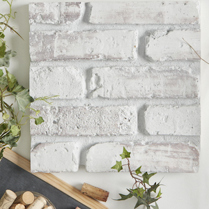 up close of brick faux wall panel from Barron Designs in color finish Glacier 