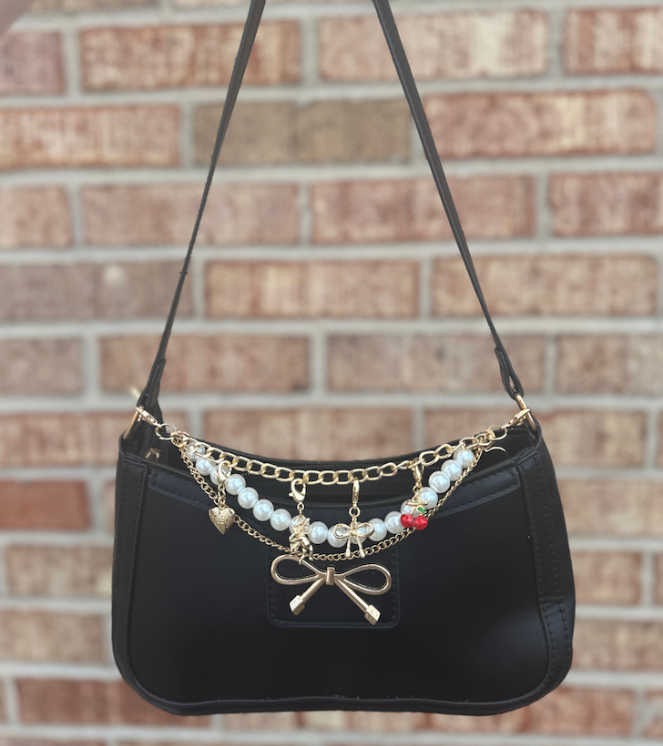 Black purse with bag charms