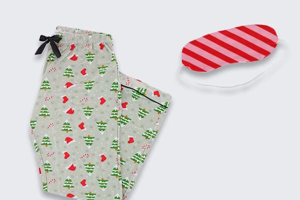 Holiday pajama pants and sleepmask