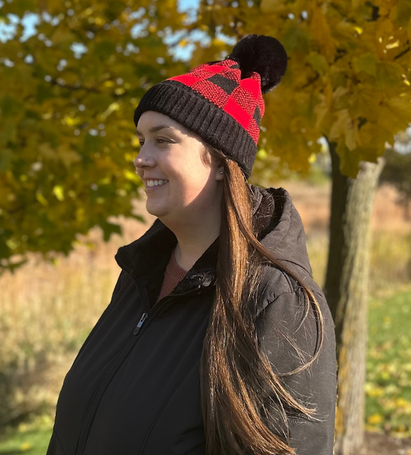 Woman wearing buffalo plaid winter beanie outside