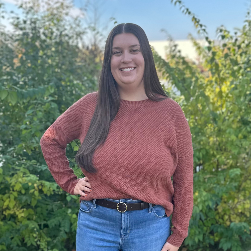 Woman wearing brown leather belt outside