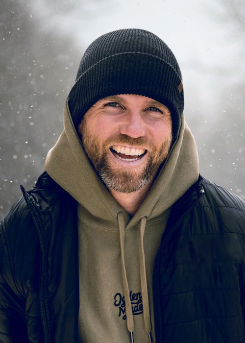 Man wearing beanie in snow