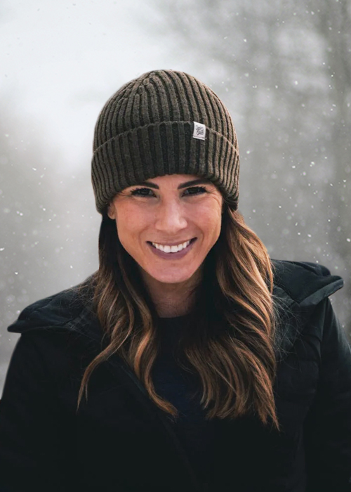 Woman wearing beanie in snow