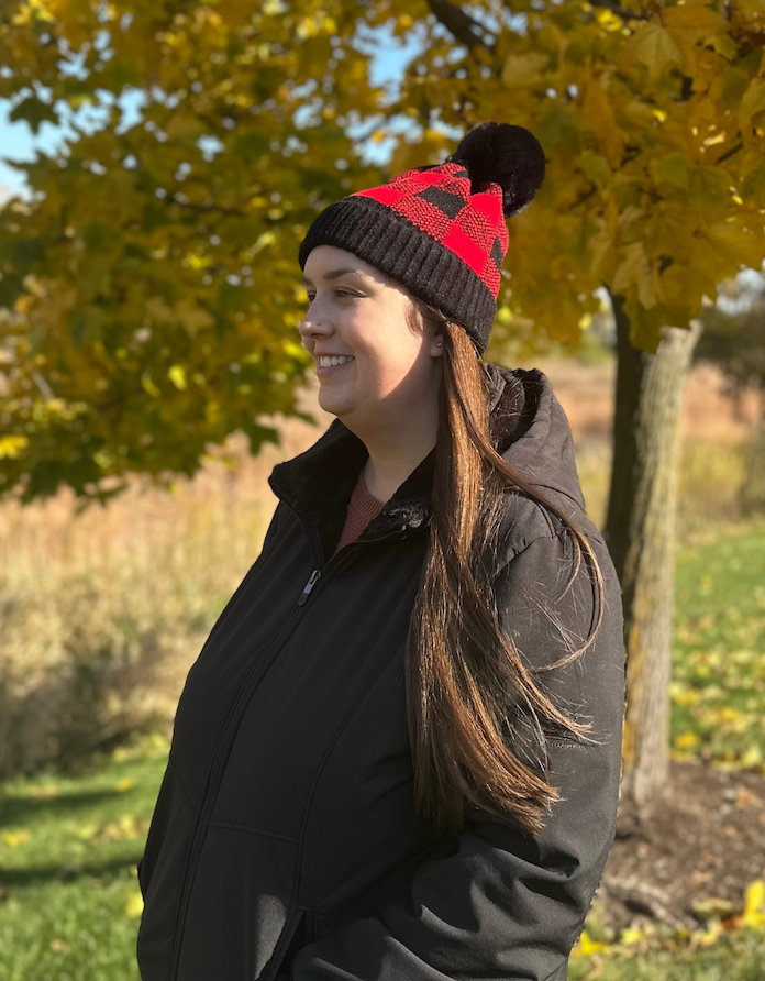 Woman wearing buffalo plaid winter hat