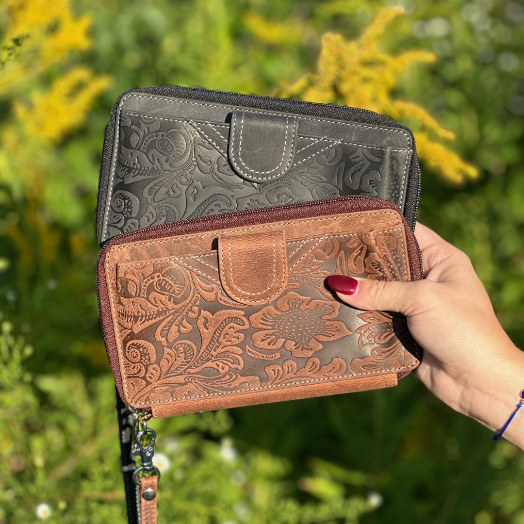 CTM® Women's Embossed Floral Tooled Leather Wristlet in black and brown