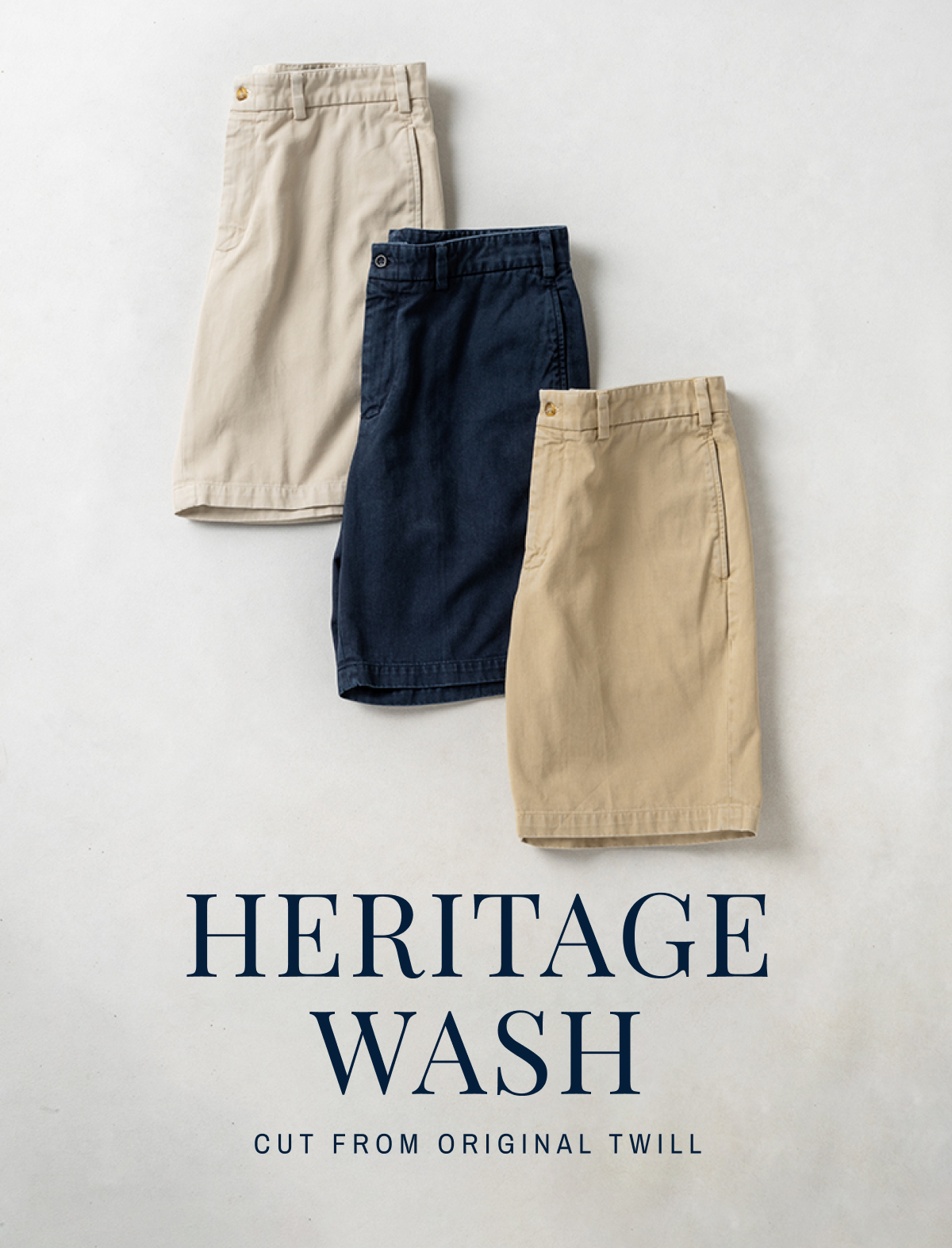 A photo of Bills Khakis new Heritage Wash Shorts. Text reads Heritage Wash - Cut from Original Twill