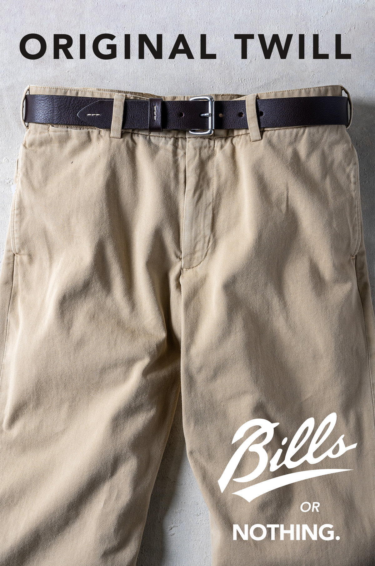 A crop of the top half of a pair of Bills Khakis khaki Original Twill pants. Text reads 
