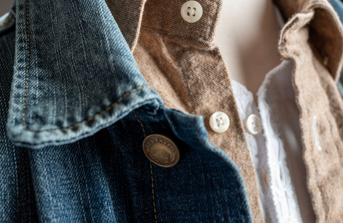 A color closeup of Bills Khakis tan brushed flannel with an outer denim jacket