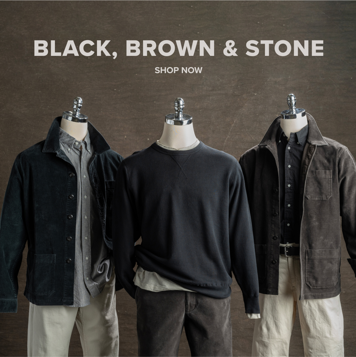 Three mannequins sit outfitted in black, brown & stone Bills Khaki outfites from top to bottom - including chore jackets, over shirts, standard fit shirts, pants and belts. Text reads: Black, Brown & Stone | Shop Now.