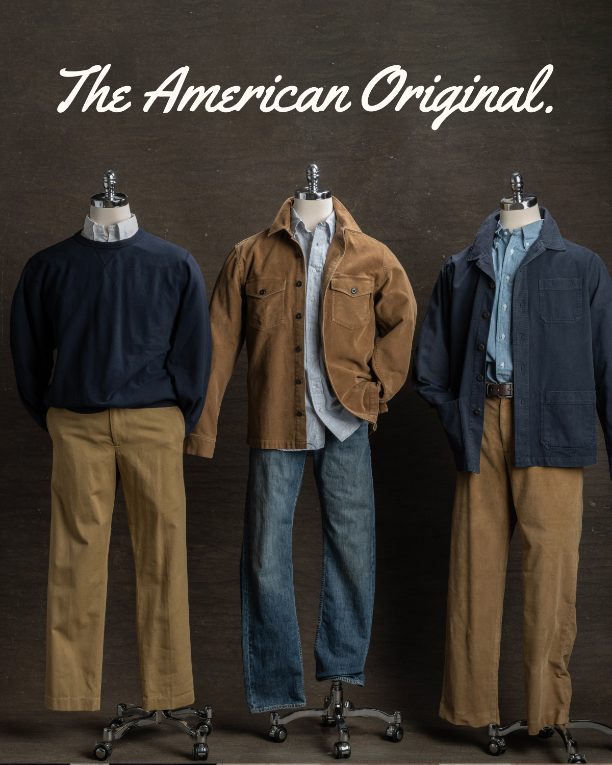 Three mannequins stand against an industrial brown backdrop wearing blue and khaki colored Bills Khakis tops, shirts and pants