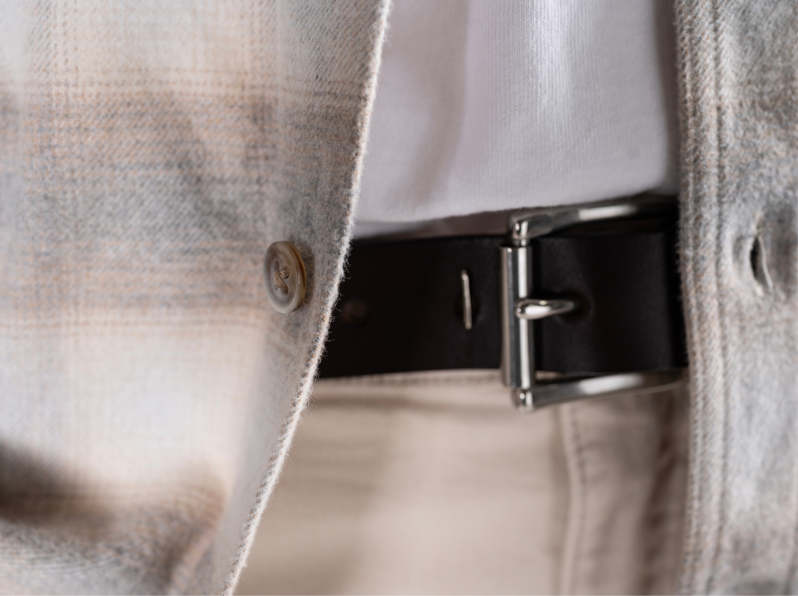 A detail of a Bills khaki brushed flannel overshirt as it covers Bills henly, belt, and khakis
