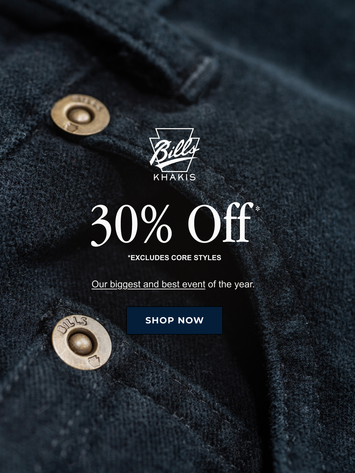 A close up of a navy pair of Bills Khaki pants showcasing the pocket and belt loop stitching alongside Bills Khakis branded rivets. The Bills Khaki logo overlays the image along with text that reads: 30% Off* | *Excludes Core styles | Our biggest and best event of the year | Shop Now