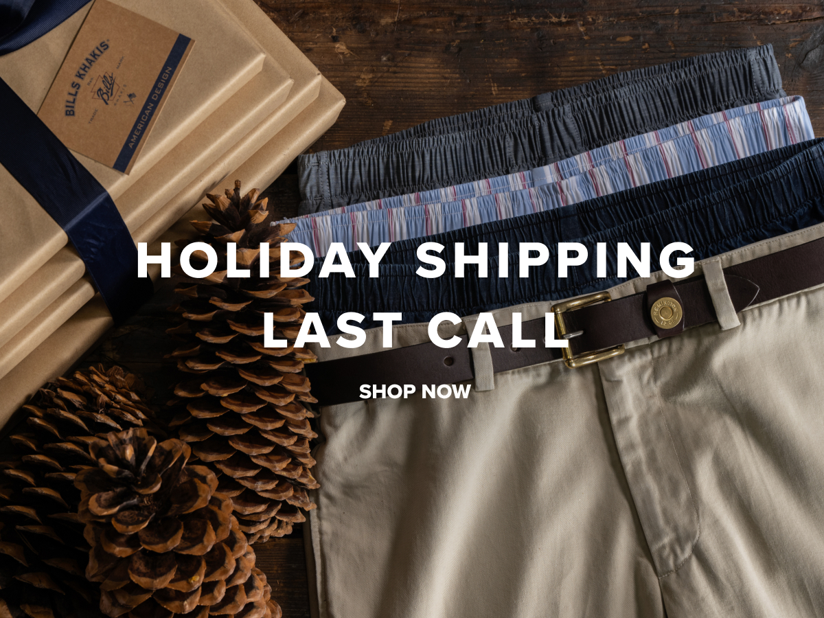 Pair of Bills Khakis pants and boxers sitting next to wrapped holiday shopping boxes with a navy blue bow