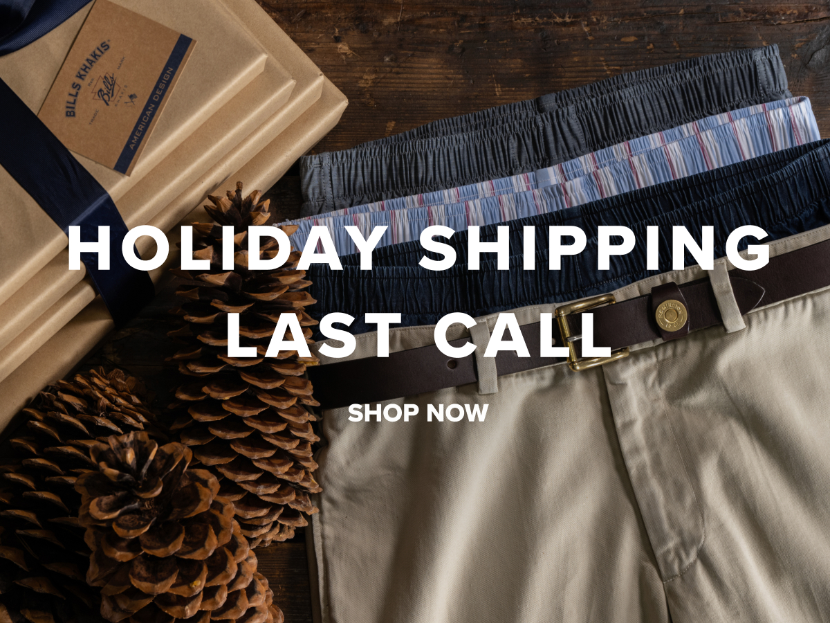 Pair of Bills Khakis pants and boxers sitting next to wrapped holiday shopping boxes with a navy blue bow