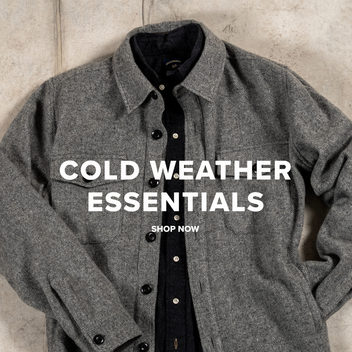 A Bills Khakis Wool Herringbone Shirt Jacket lays on an industrial surface. Text reads 'Cold Weather Essentials - Shop Now'