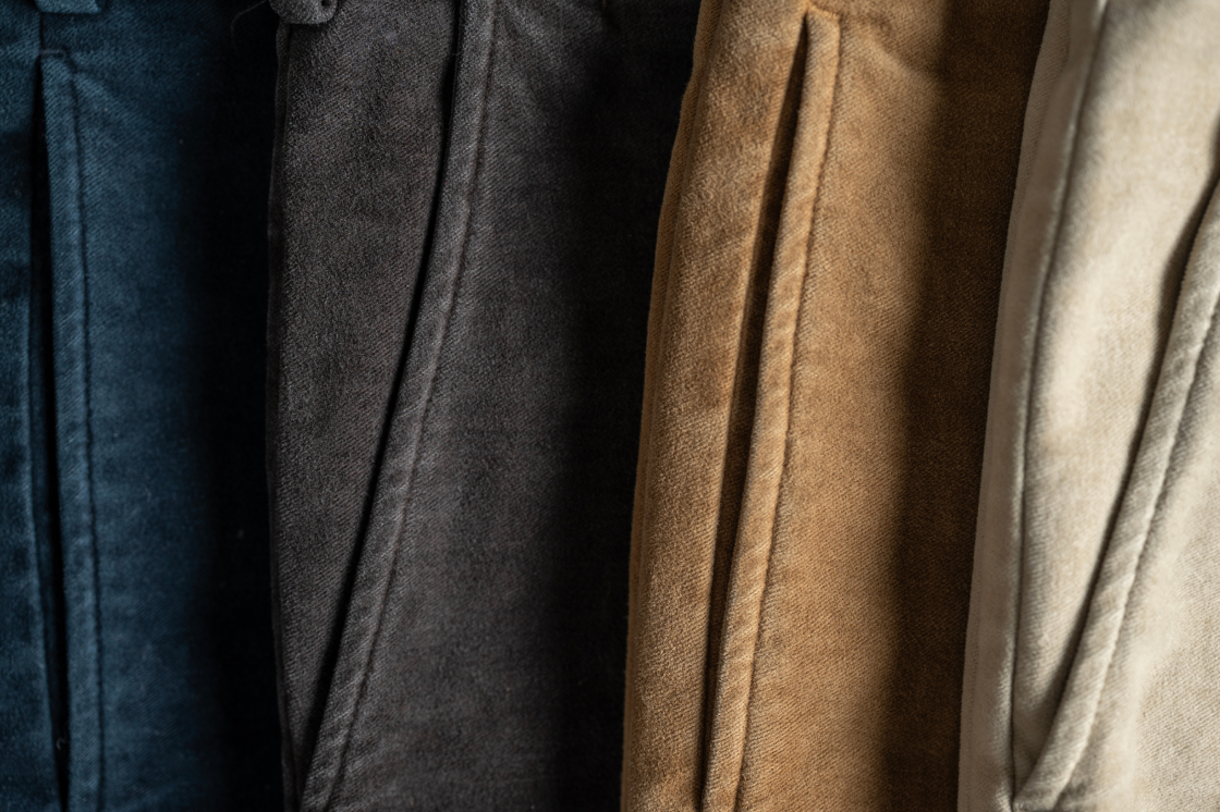 Four pairs of Bills Khakis moleskin pants are shown in tight detail around their pocket seem.