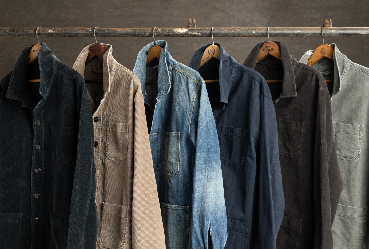 Six Bills Khakis chore jackets on display hanging from an industrial pole