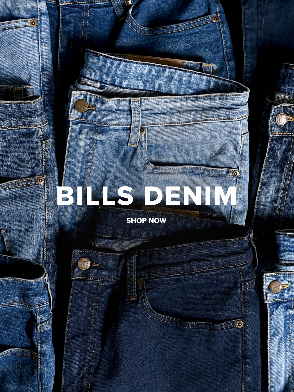A laydown of nine pairs of Bills khakis denim pants in different shades. A text overlay reads: Bills Denim | Shop Now