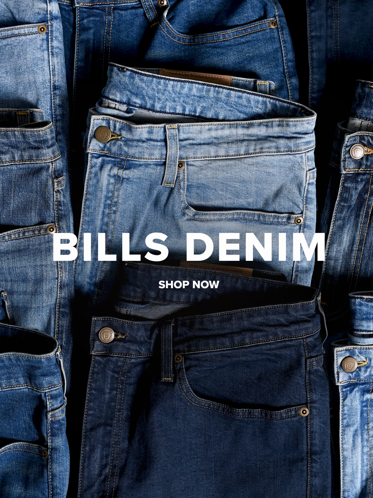 A laydown of nine pairs of Bills khakis denim pants in different shades. A text overlay reads: Bills Denim | Shop Now
