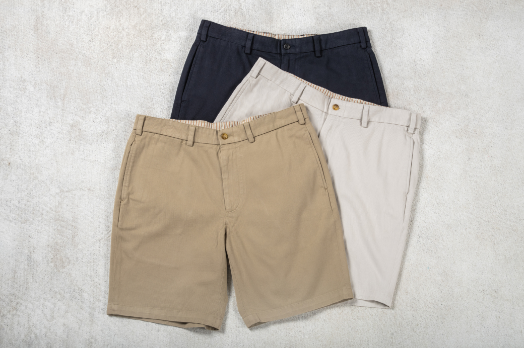 Three pairs of Bills Khakis Vintage Twill shorts on a light colored surface