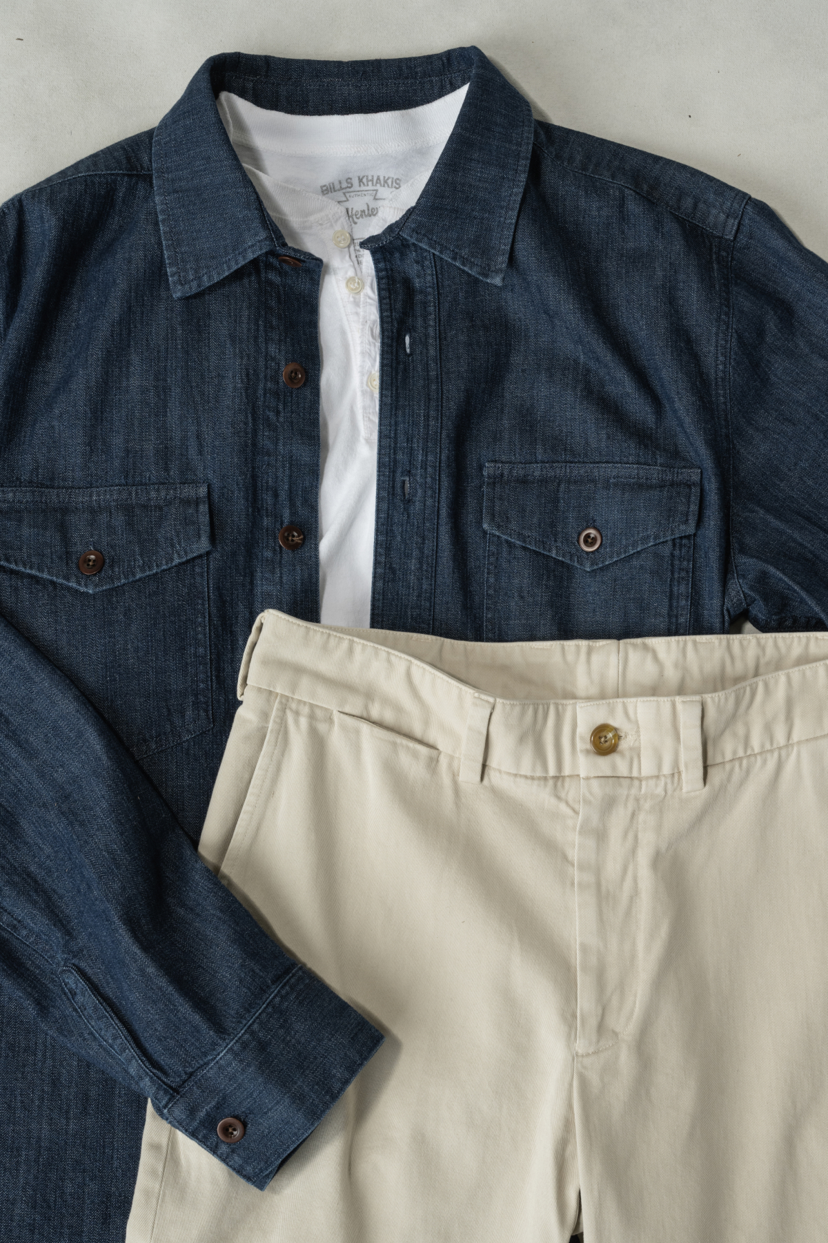 A Bills Khakis Lightweight Denim laydown, along with a Bills Henly and Khaki pants