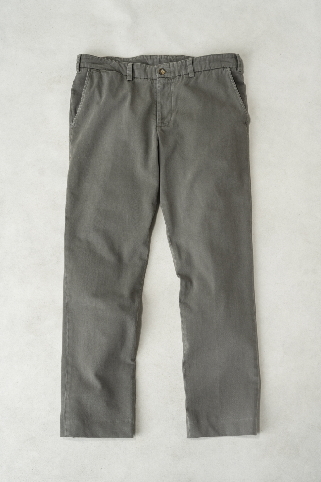 A full laydown shot of Bills Khakis Heritage Wash pants in the new Olive Stone colorway