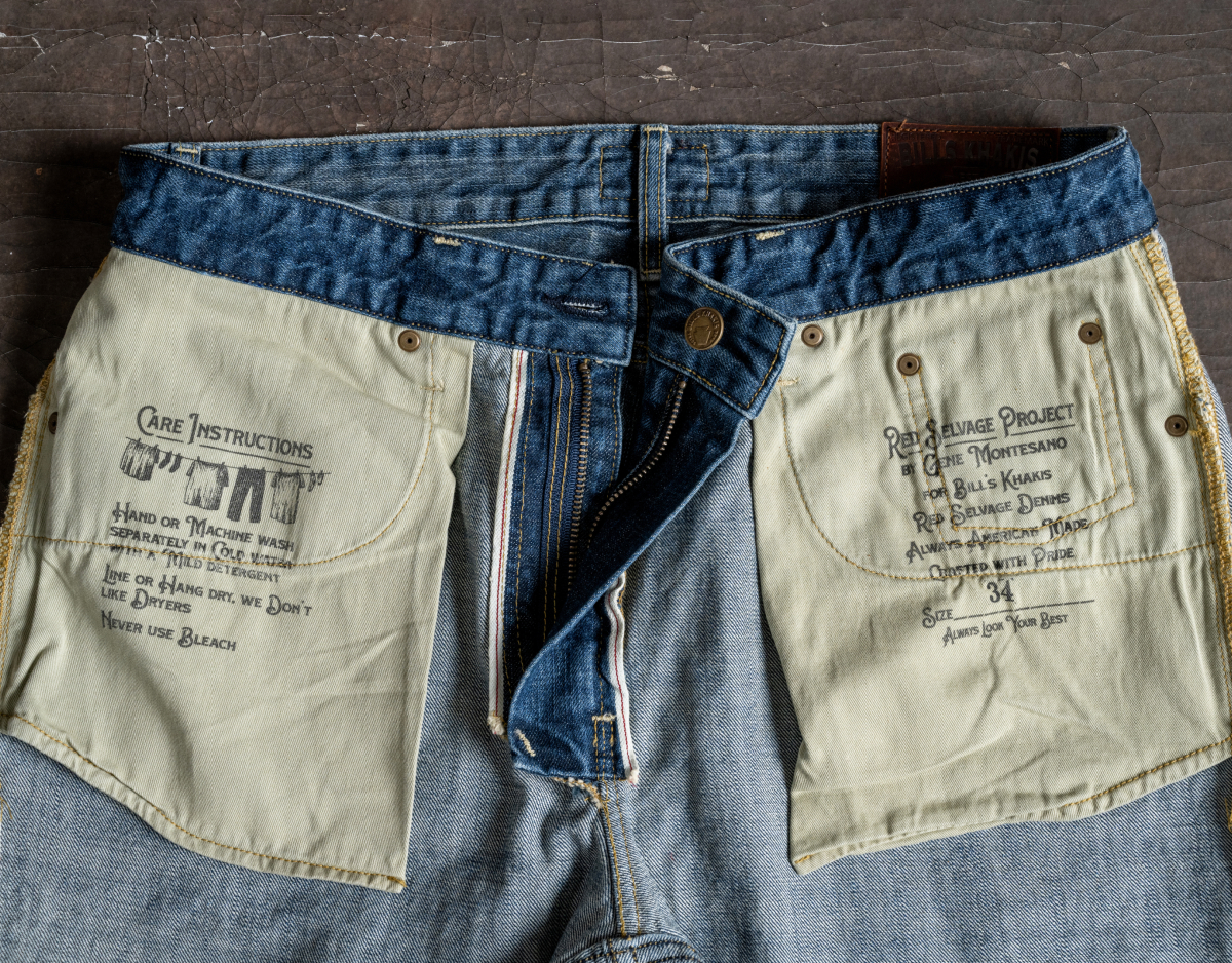 A close up photo of the interior pockets of a pair of Bills Khakis Red Selvage Denim pants showing off stitch work, illustrated care instructions, and written information about the collaboration.